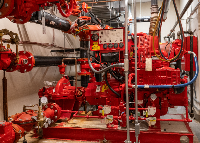 Red boiler system in the basement of a housing complex